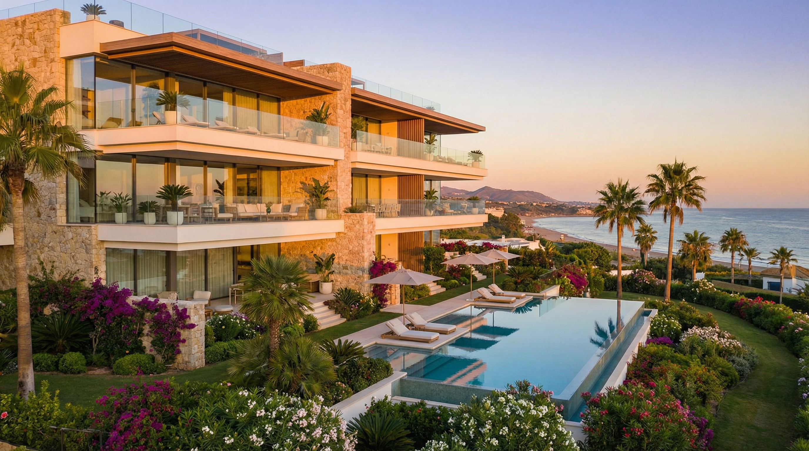 Modern branded residence in Costa del Sol with sleek architecture, luxurious balconies, ocean views, and lush Mediterranean landscaping at golden hour.