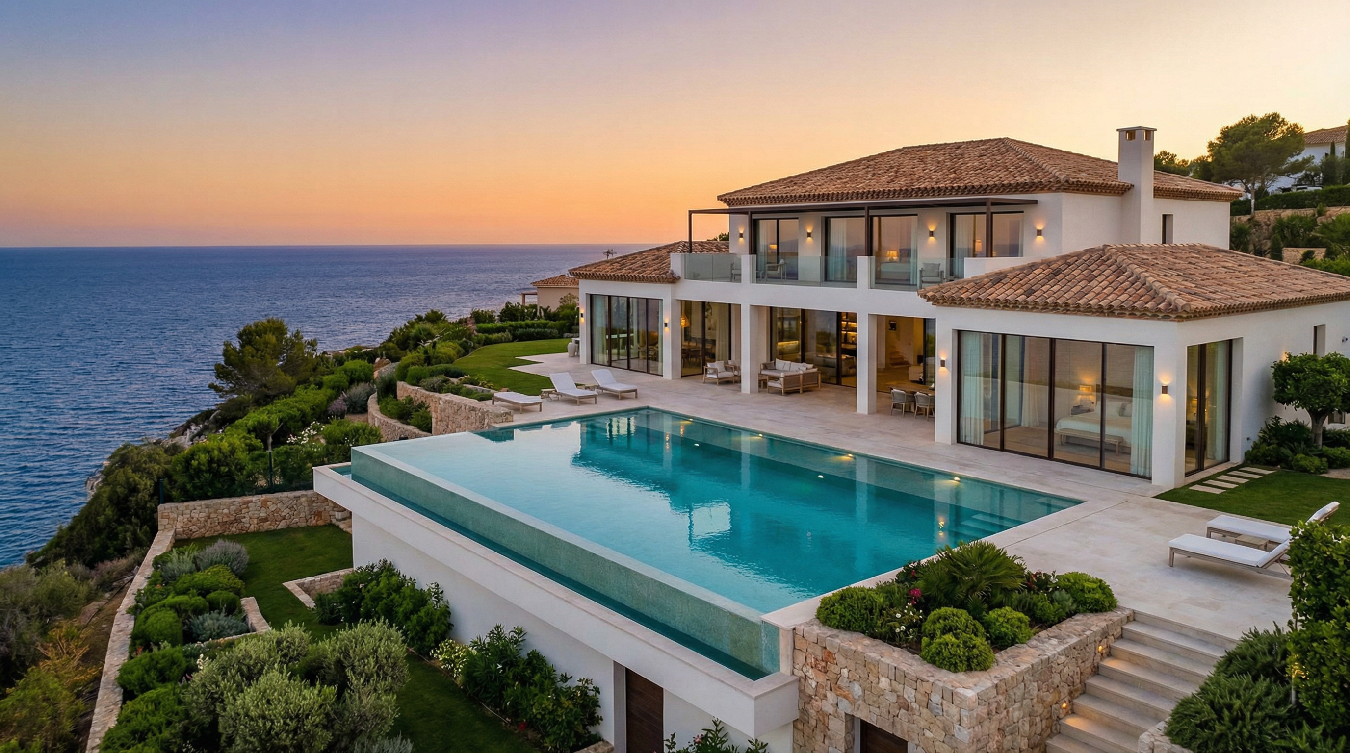 A digital nomad working on a laptop at a beachside café in Costa del Sol, Spain, with palm trees and the Mediterranean Sea in the background.